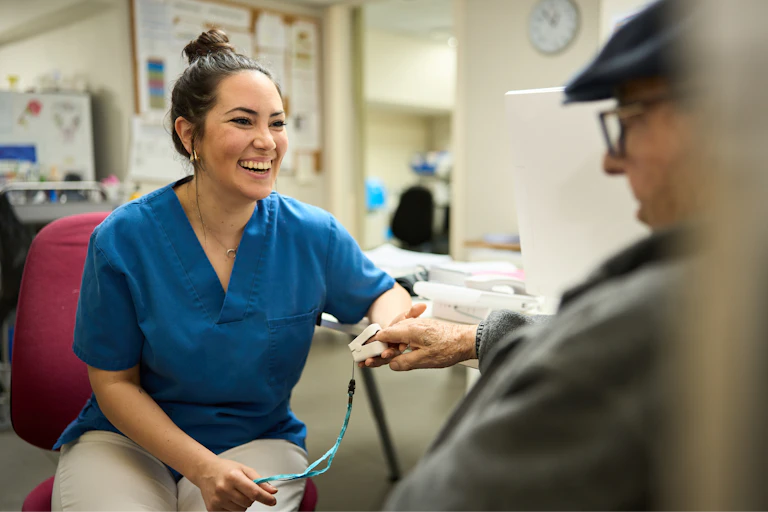 Nurse laughs with patient