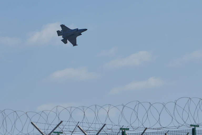 Fighter aircraft seen above a security fence at RAF Akrotiri in Cyprus