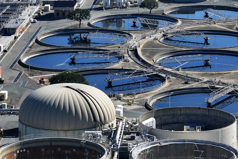 An aerial view of large round basins of water.