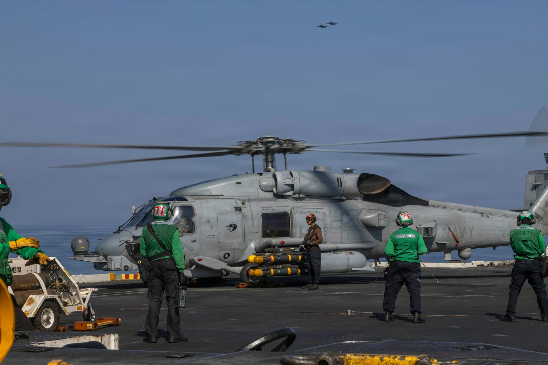 MH-60R Sea Hawk helicopter prepares to take off from the USS Abraham Lincoln 