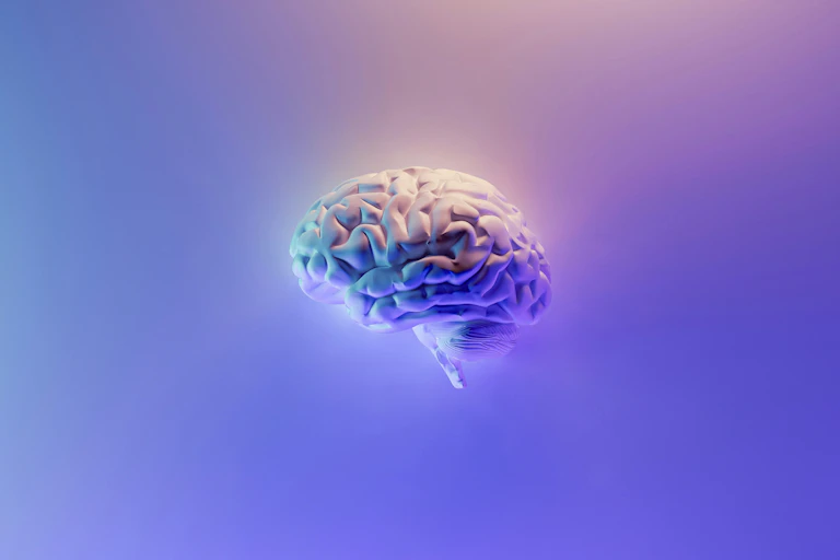 A digital brain on a pastel background.