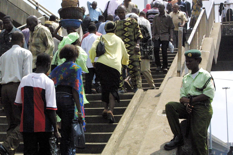People crossing a pedestrian bridge