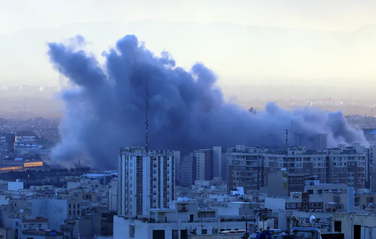 Smoke over city skyline.