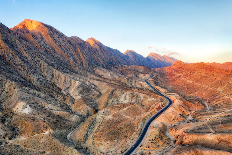 dramatic dusty mountain landscape with road