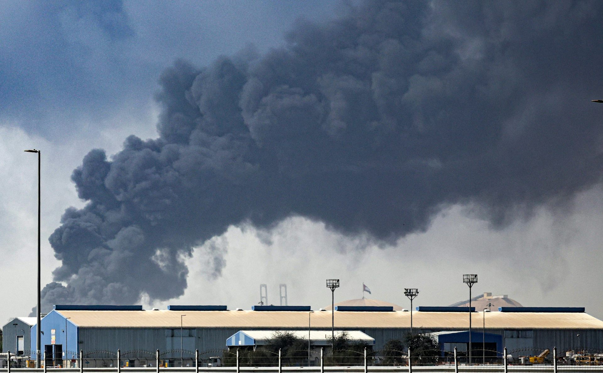 Thick black smoke billows into the air above the Jebel Ali port in Dubai.