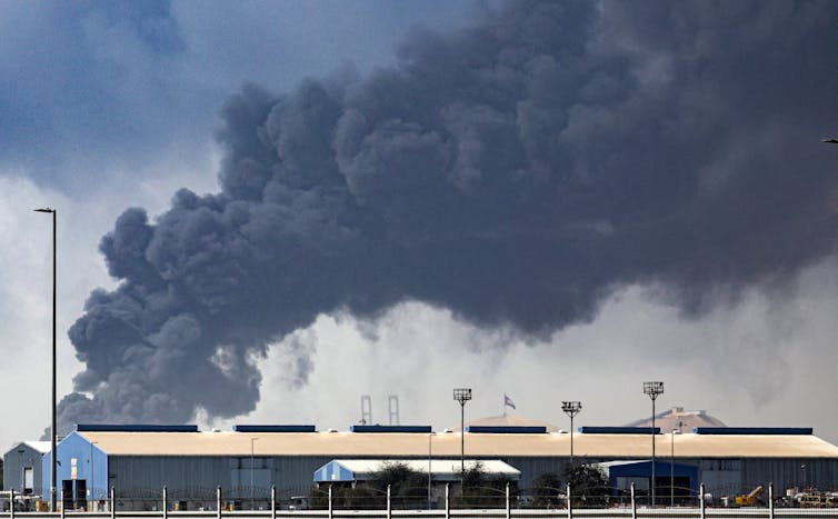Thick black smoke billows into the air above the Jebel Ali port in Dubai.