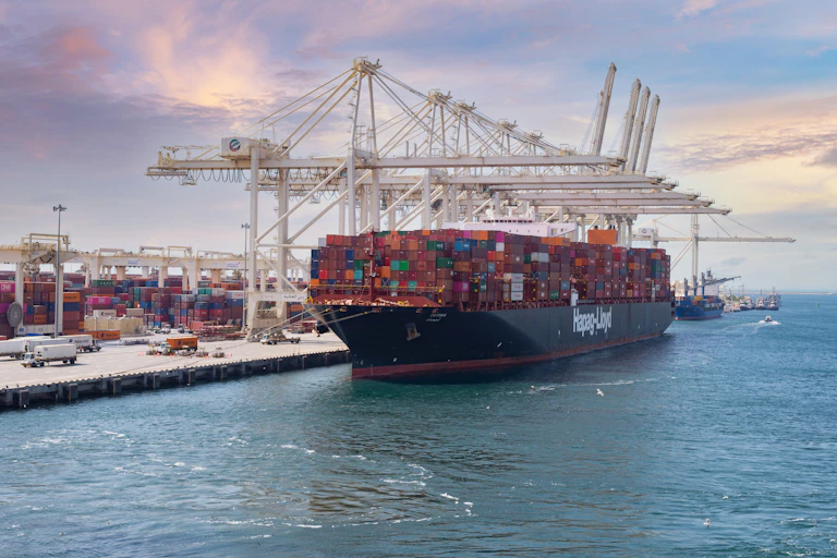 a ship laden with containers sits in jebel ali port in the united arab emirates.