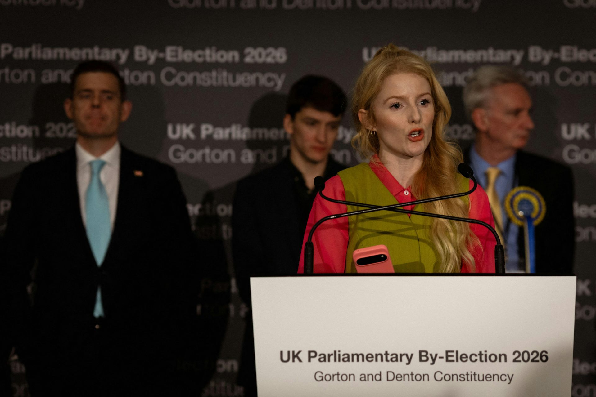 Hannah Spencer gives a speech in front of the other candidates in the Gorton and Denton byelection.
