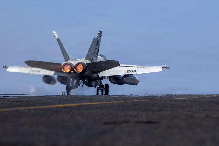 Fighter jet takes off from aircraft carrier