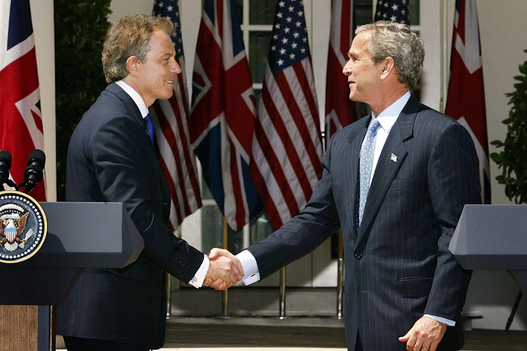 George W Bush shakes hands wtih Tony Blair outside the White House