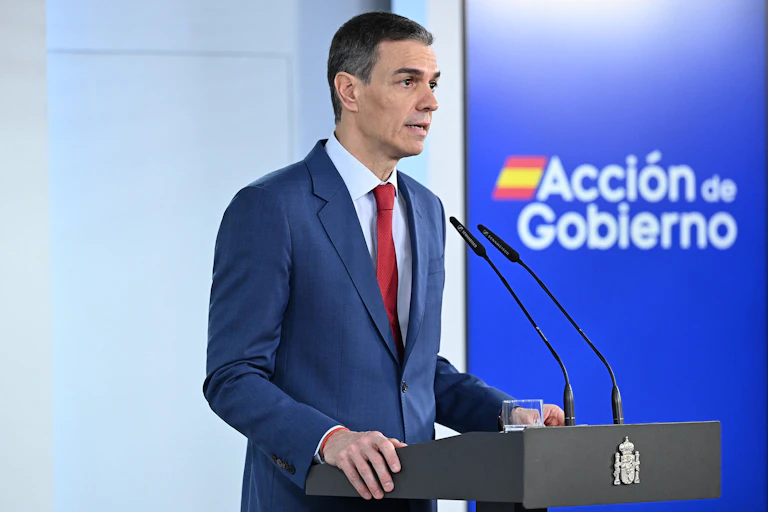 A man at a lectern giving a speech.