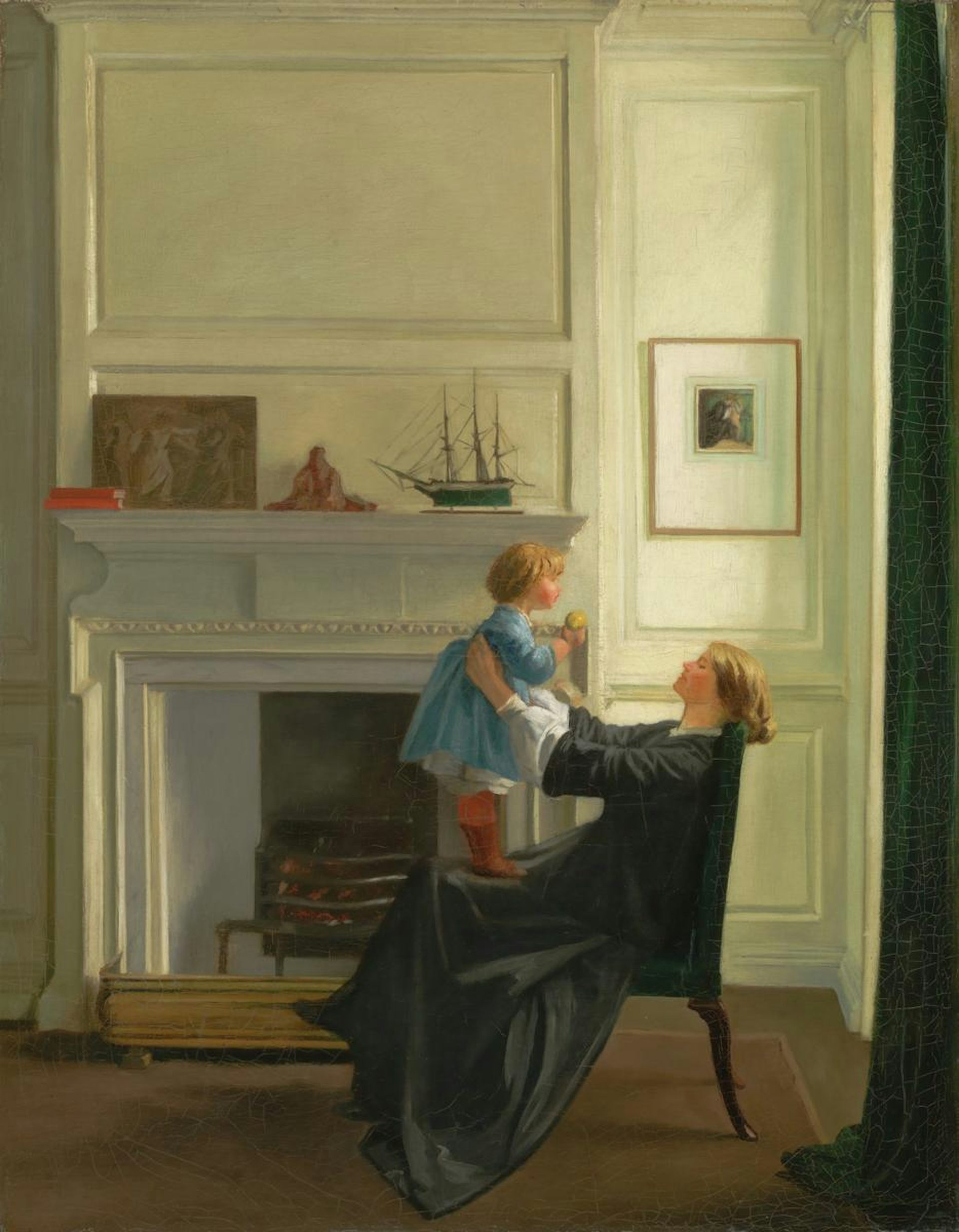 A mother holding her child in front of her