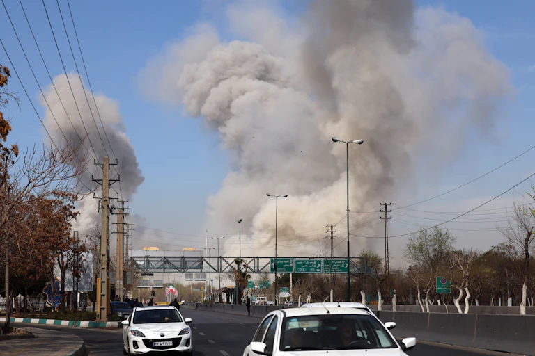 Smoke rises after an airstrike in Tehran.