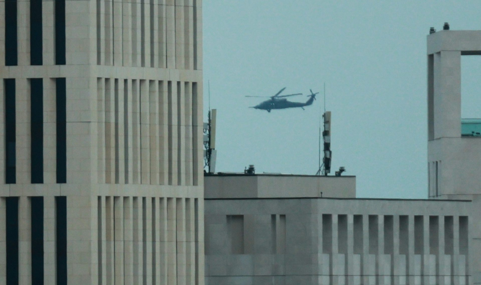 A military helicopter flies over Doha.