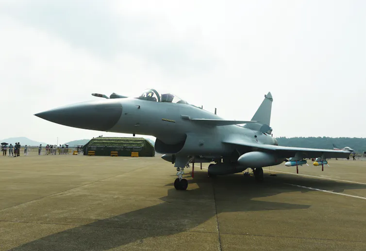 A sleek fighter jet is seen on the ground