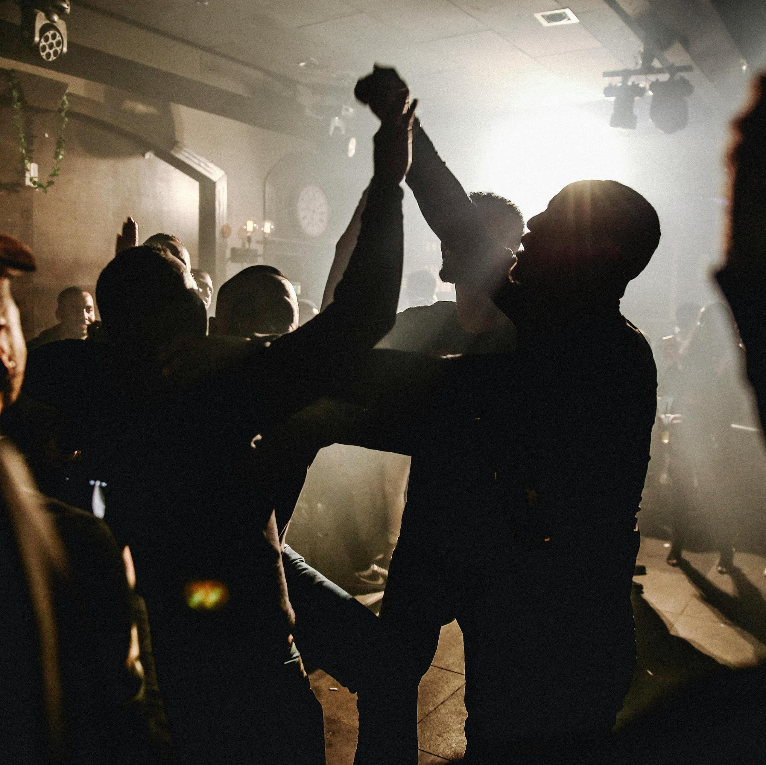 Silhouette of people dancing