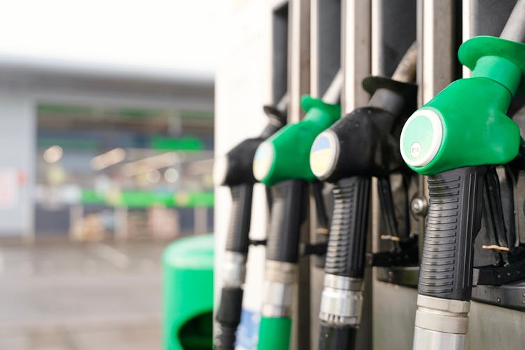 generic diesel and petrol pumps in a filling station forecourt.