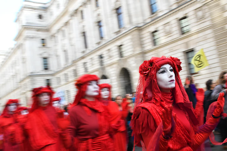 Protesters dressed in red in Whitehall