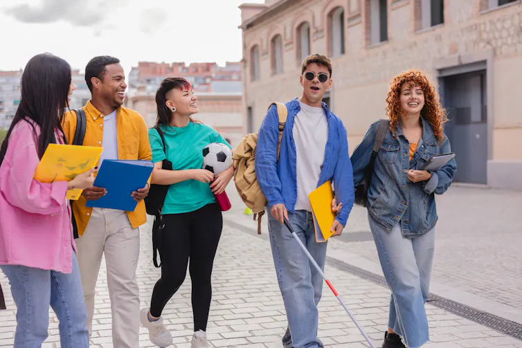 Group of students, including one with a visual impairment