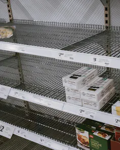 Empty shelves in a grocery store.