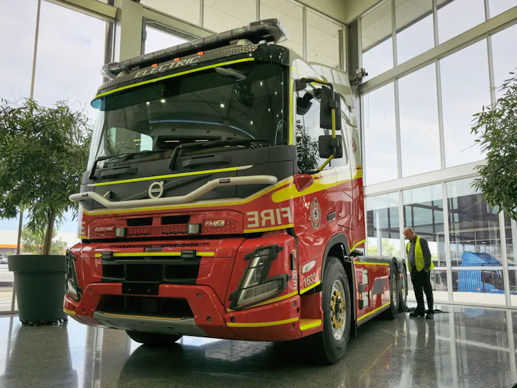 electric fire truck prime mover inside a showroom.