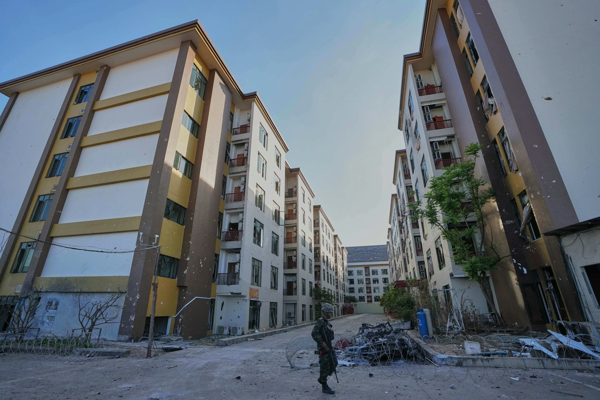 A Thai soldier keeps guard outside a scam center in O'Smach, Cambodia.
