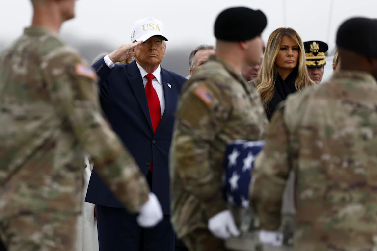 Donald Trump salutes as the remains of American soldiers who were killed in an Iranian drone attack in Kuwait are returned to the US.