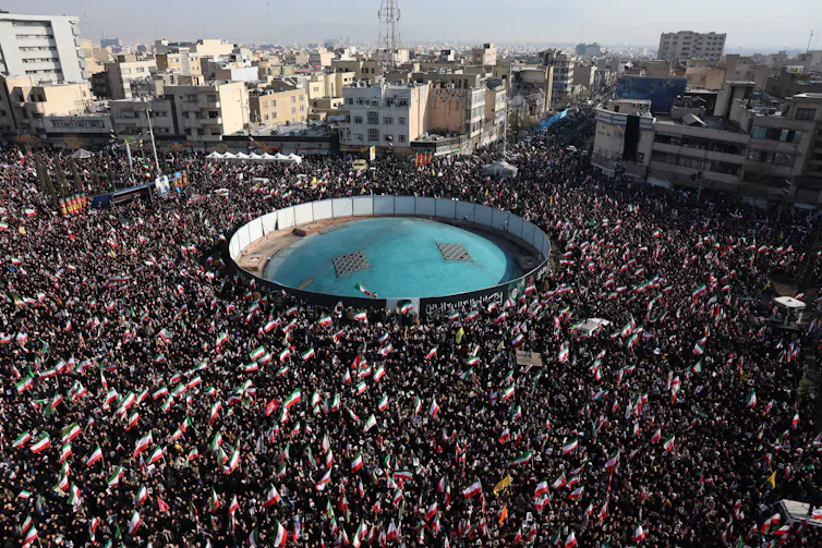 A large crowd of people gathered at Enqelab Square in Tehran, Iran.