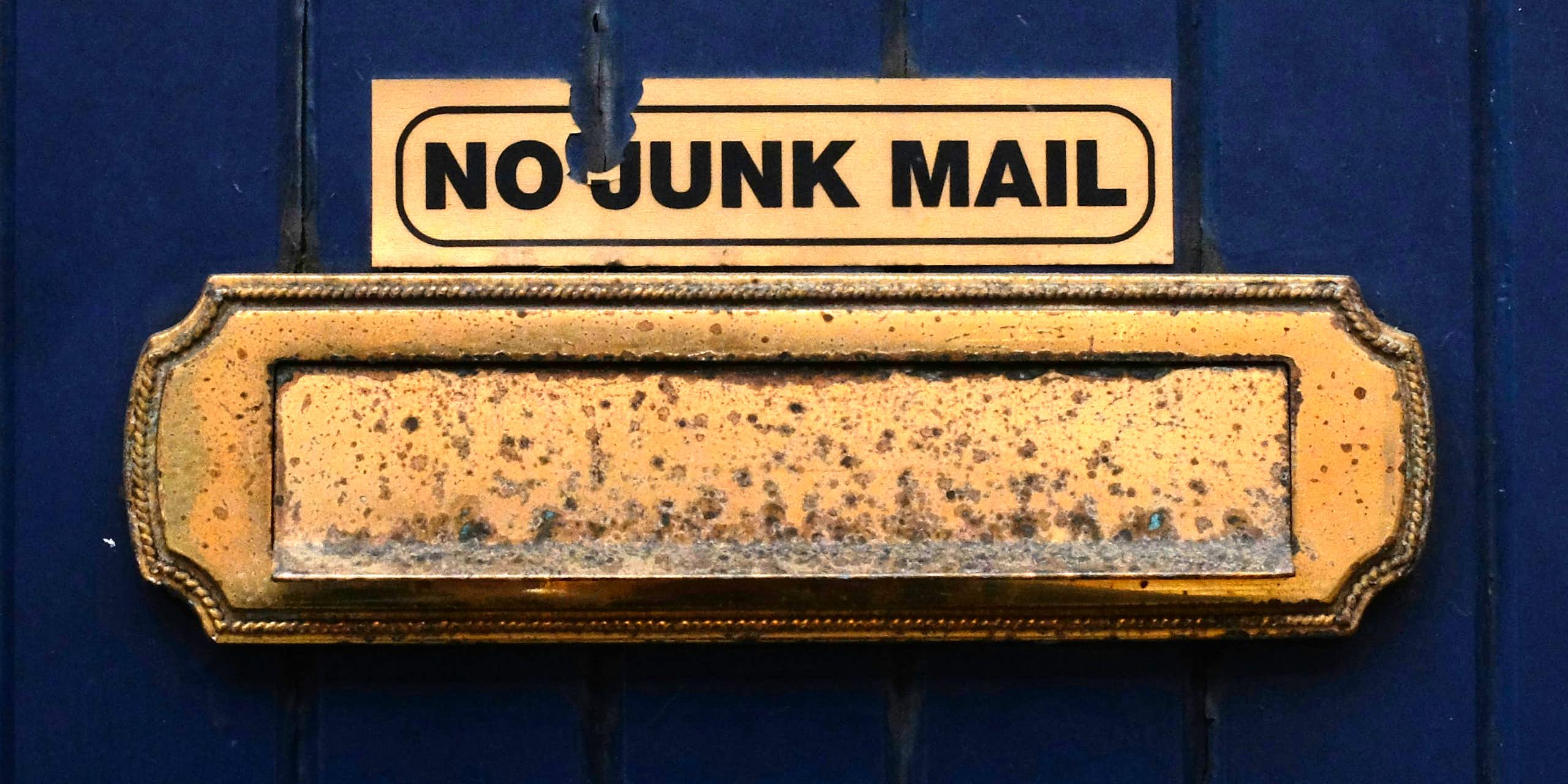 A no junk mail sign above a door's letterbox