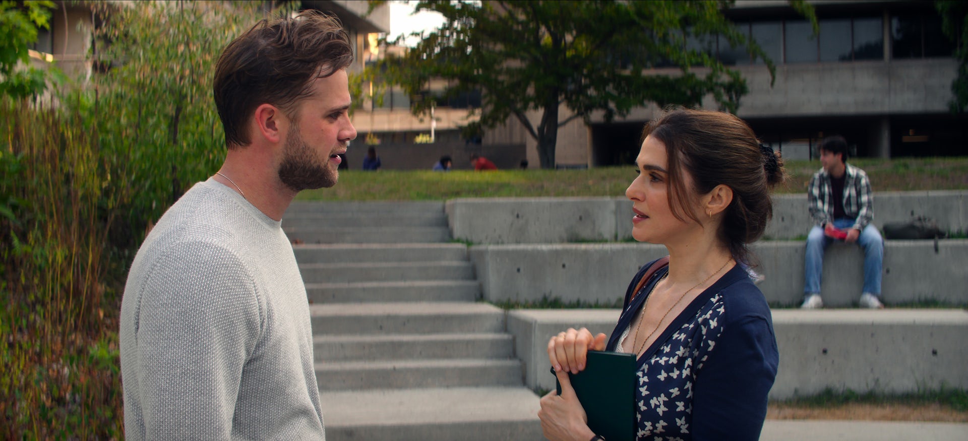 a man and woman look at each other