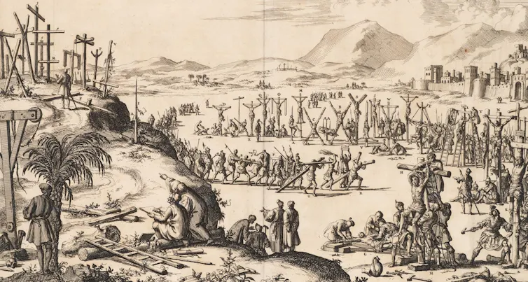 Grabado en blanco y negro de muchas personas crucificadas.