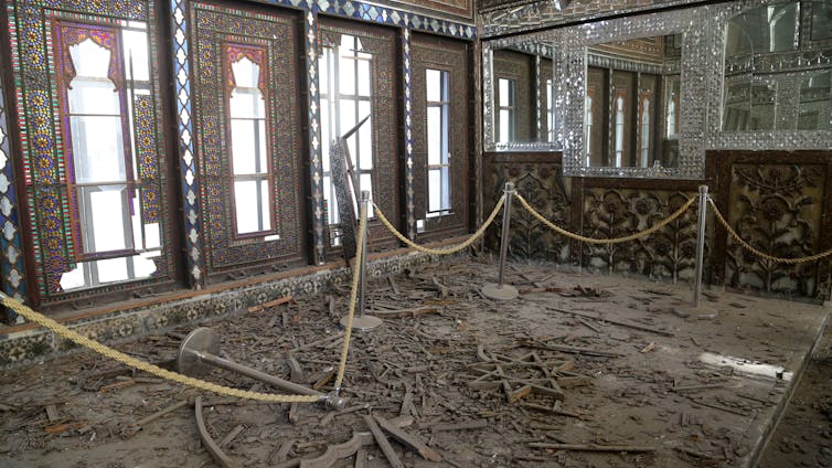 Debris litters the floor inside Golestan Palace