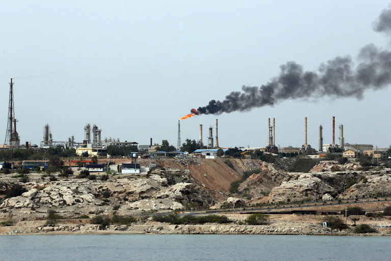 Smoke rising from a chimney on the Kharg oil terminal.
