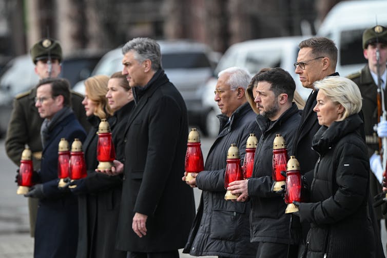 Ukrainian president, Volodymyr Zelensky, with European leaders holding candles to mark the fourth anniversary of the beginning of the war, February 24 2026.
