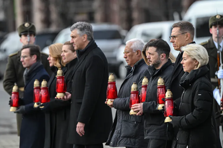 Ukrainian president, Volodymyr Zelensky, with European leaders holding candles to mark the fourth anniversary of the beginning of the war, February 24 2026.