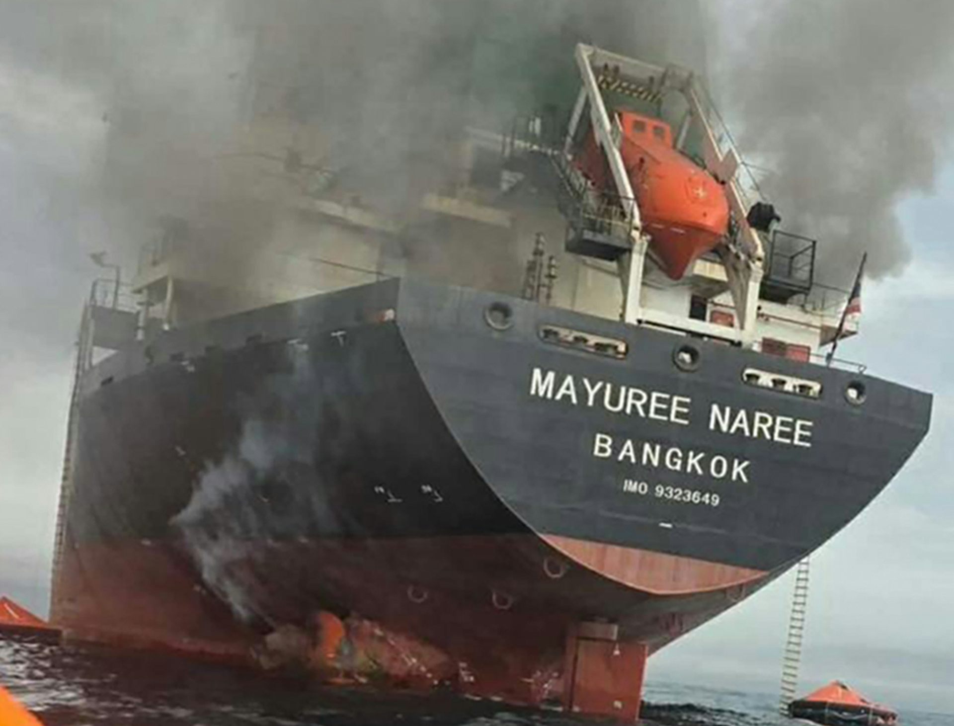 A Thai cargo ship on fire after being struck by missiles in the strait of Hormuz.