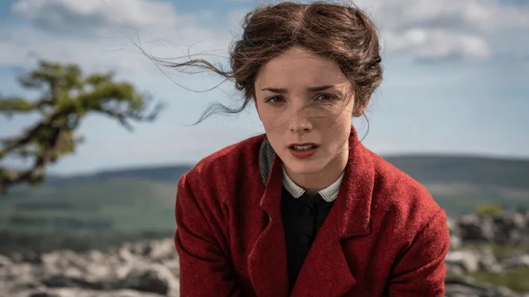 young woman in a red coat