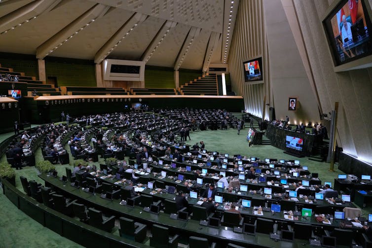 Iran’s ruling construction defined 2 A wide angle photo of a political body and its permanent seats.