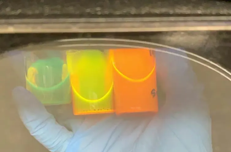 Containers full of glowing liquid