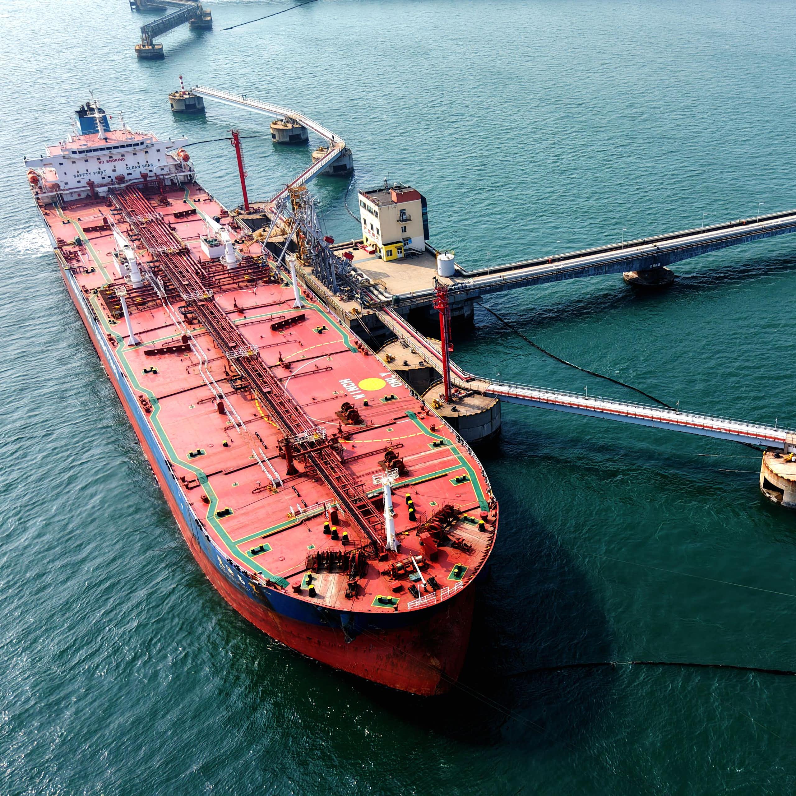 A photo of an oil tanker unloading fuel.