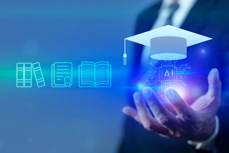 A graduate hat above a human hand against a blue-lit background