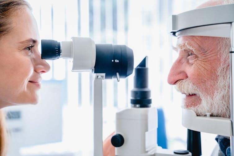 A man having his eyes examined.