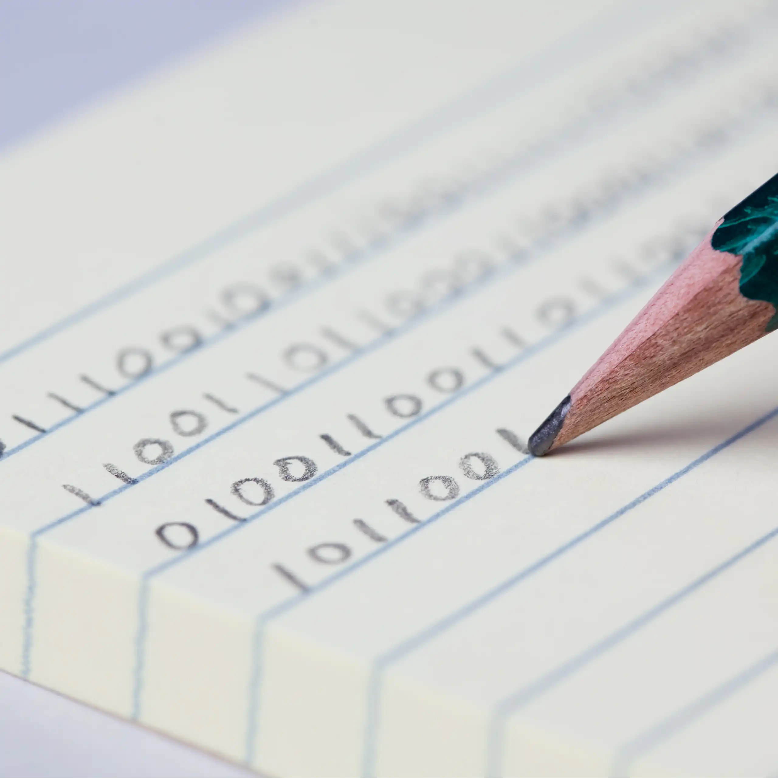 A hand holding a pencil and writing binary code on lined paper.
