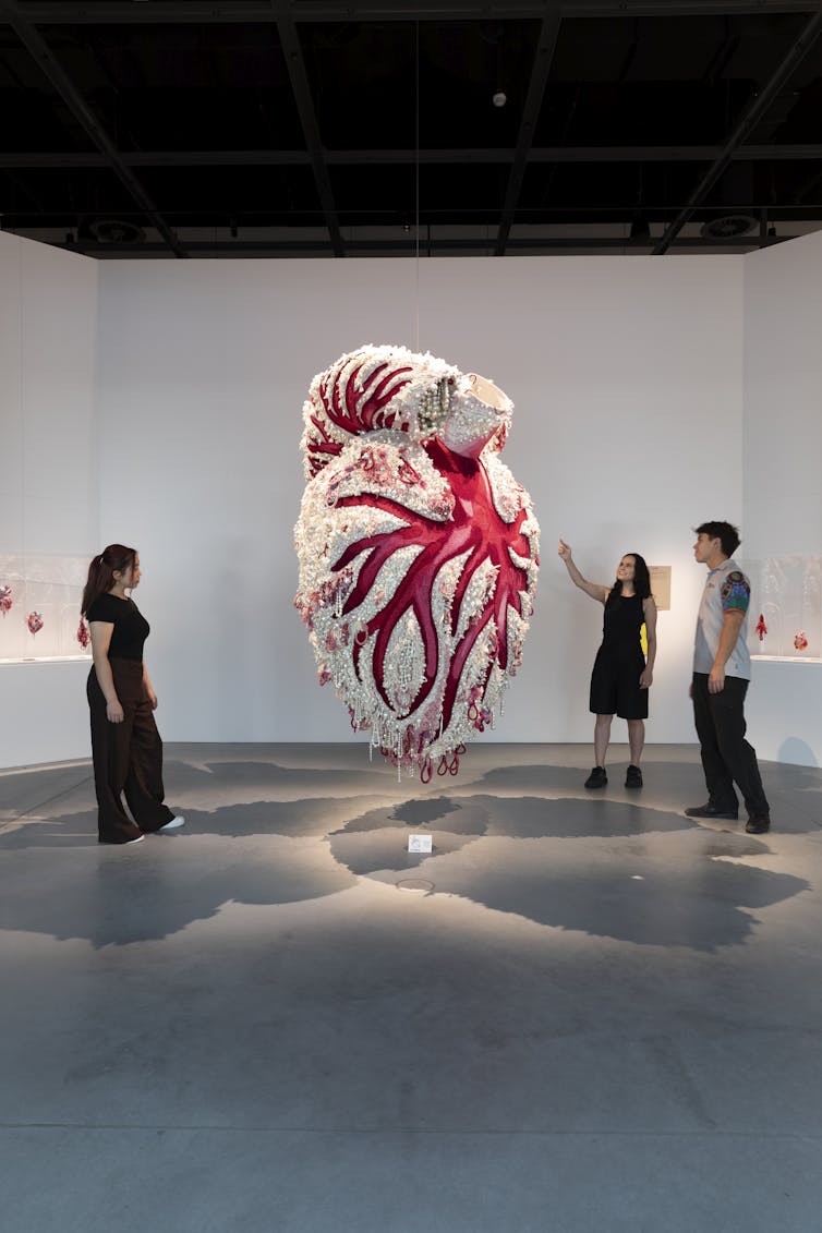 Gallery image: visitors around a giant heart.
