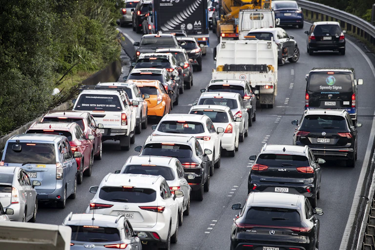 Three lanes of congested traffic on a highway