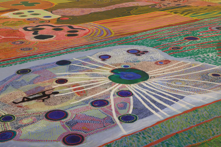 Detailed view of an intricate canvas from Aboriginal artists.