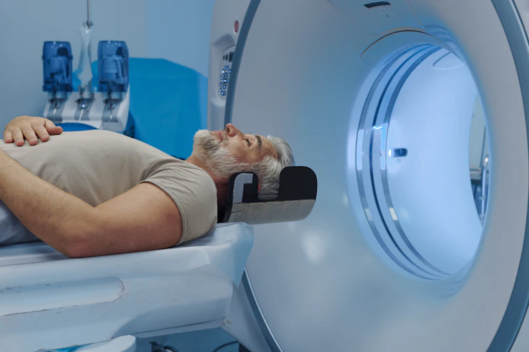 A man about to enter an MRI scanner.