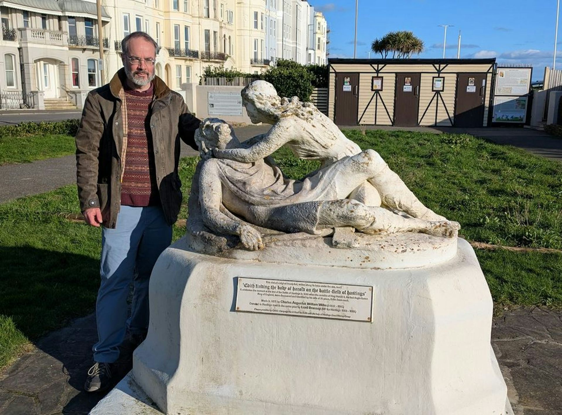 The author standing with a statue of Harold and Edith