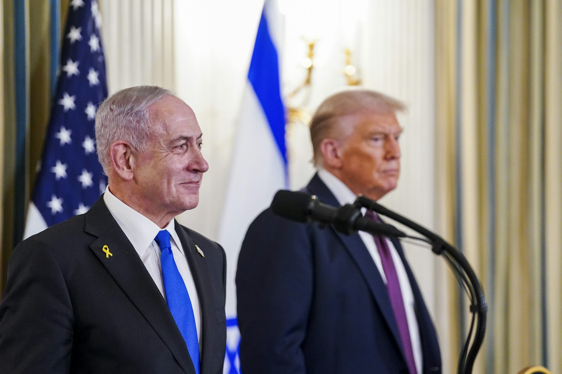Donald Trump and Benjamin Netanyahu participate in a press conference at the White House.