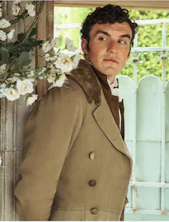 A young man in Regency dress.